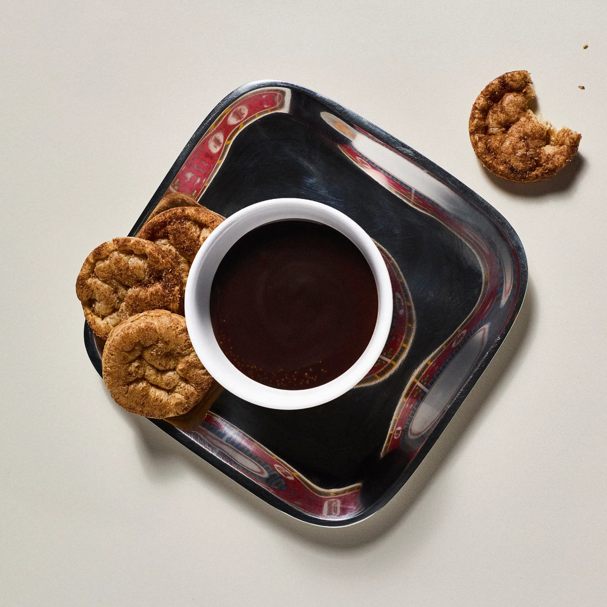 Subtle Snacks Chocolate Protein Rice Cake Minis beside a bowl of chocolate dip, one with a bite taken