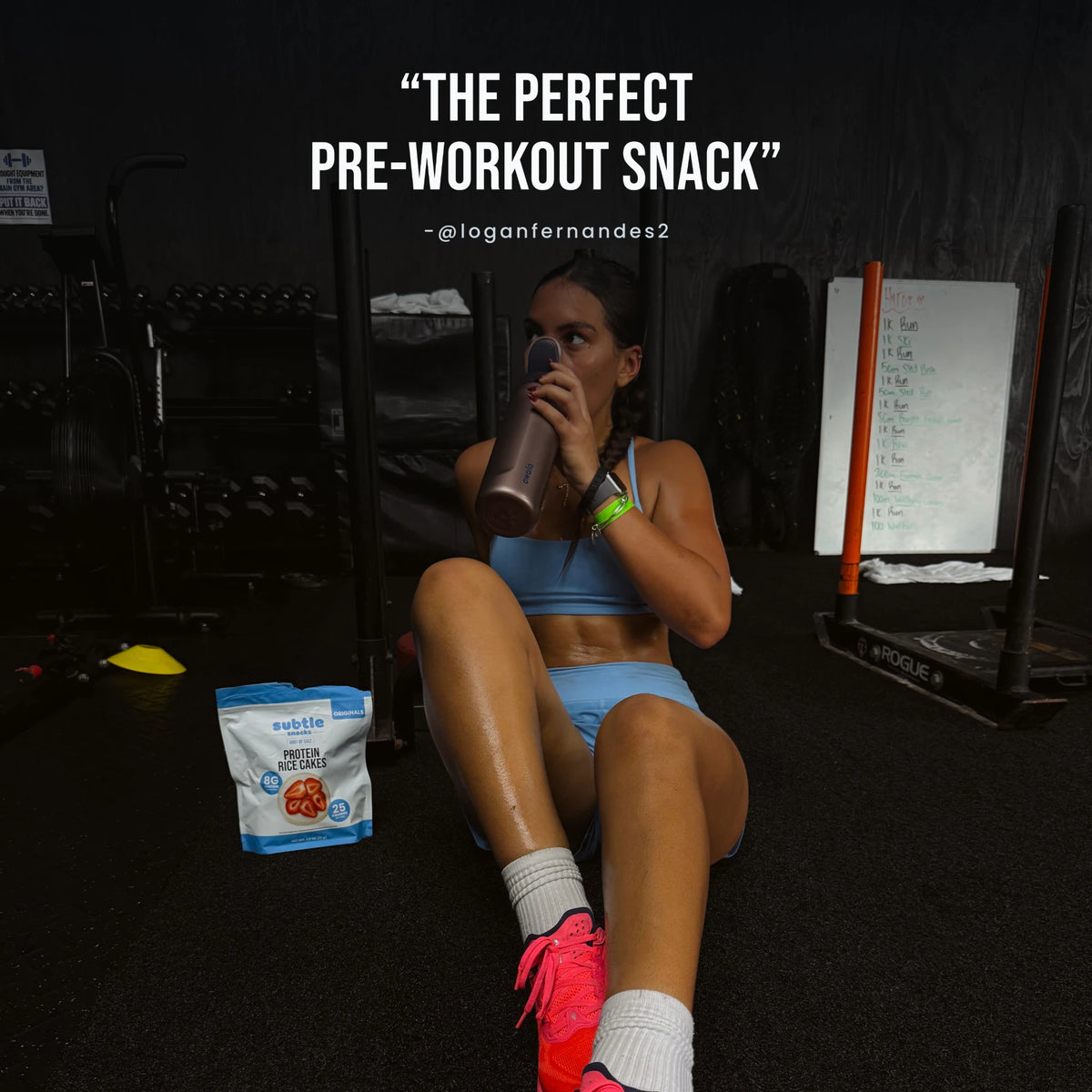 Athlete resting on a gym floor beside a bag of Subtle Snacks Hint of Salt Protein Rice Cakes, with the quote: The perfect pre-workout snack